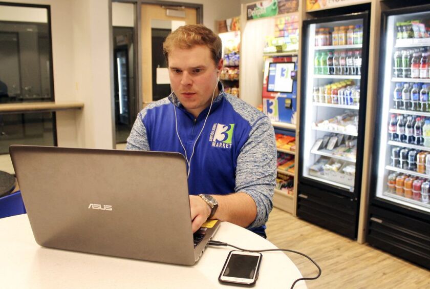 Three Square Market, a software company in River Falls, Wis., is offering to microchip its employees, enabling them to open doors, log onto their computers and buy break room snacks with a simple wave of the hand. | AP Photo