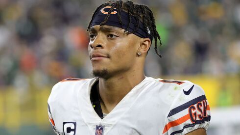 Quarterback Justin Fields leaves the field after the Bears’ loss Sunday night.