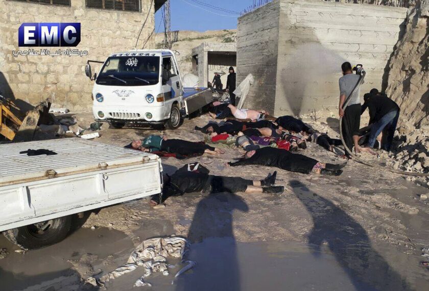 This photo provided by the Syrian anti-government activist group Edlib Media Center, which has been authenticated based on its contents and other Associated Press reporting, shows victims of a suspected chemical attack in the town of Khan Sheikhoun. The s