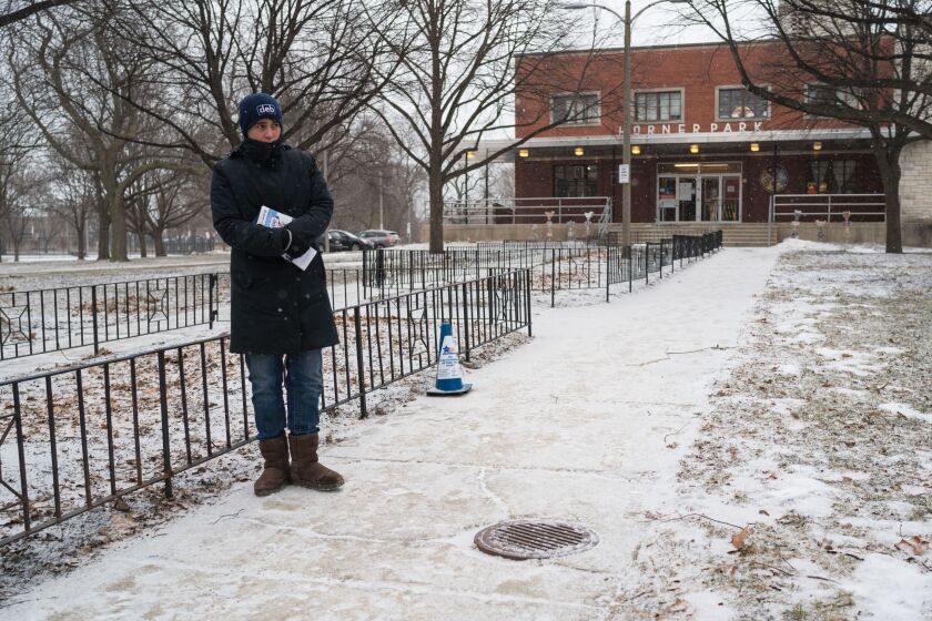Ald. Deb Mell (33rd) stands behind the blue “no electioneering” cones outside the Horner Park Fieldhouse after being issued a warning by election judges for crossing the cones twice on February 26, 2019. | Max Herman/For the Sun-Times