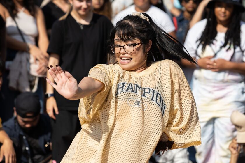Moon the Giant performs during “Youth of Chinatown,” a three-day event featuring hip-hop and K-pop performances at Chinatown Square Plaza, Saturday, Aug. 27, 2022.