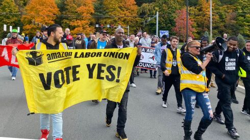 Amazon workers and supporters march during a rally in Castleton-On-Hudson, about 15 miles south of Albany, N.Y., Monday, Oct. 10, 2022.