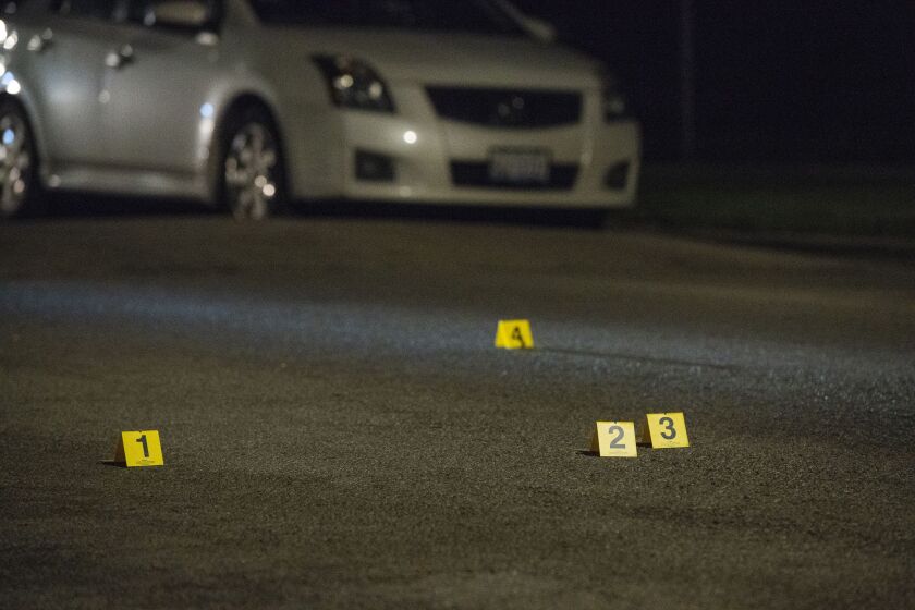 Chicago police investigate the scene where a woman who was shot Thursday night in the 8400 block of South Green. | Tyler LaRiviere/Sun-Times