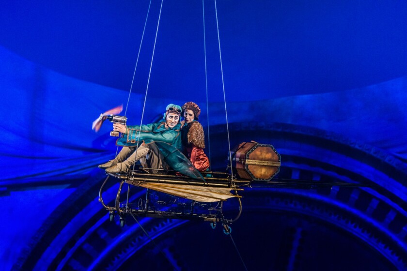 The Aviator and his passenger take flight in Cirque du Soleil’s “Kurios – Cabinet of Wonders.” Photo: Martin Girard)