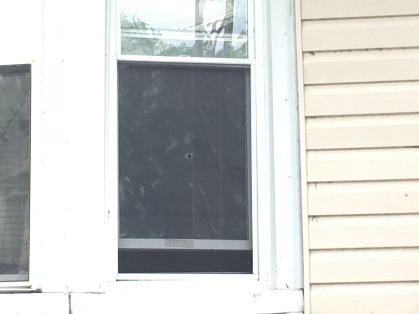 A bullet went through the window of a house in the block where four people were shot early Thursday. | Provided photo