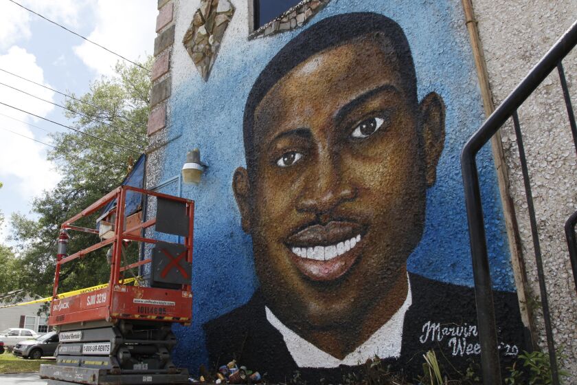 In this May 17, 2020, file photo, a recently painted mural of Ahmaud Arbery is on display in Brunswick, Ga., where the 25-year-old man was shot and killed in February.