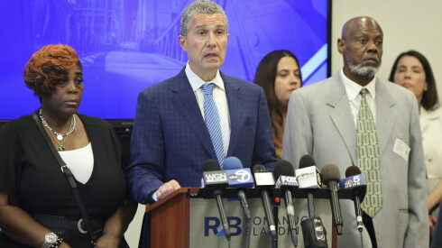 Attorney Antonio Romanucci, flanked by Derek Jordan’s parents Christine Thompkins and Derek Thompkins, discusses a recent suit filed against the city of Chicago and the officer who killed their son.