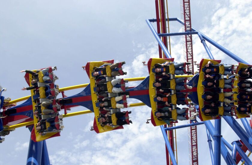 Special guests and media take a preview ride on the Superman roller coaster at Six Flags Great America in Gurnee in 2003.