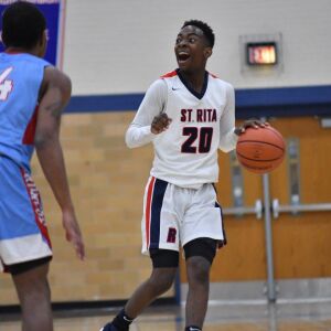 St. Rita’s Alec Millender (20) brings the ball down court. Worsom Robinson/For the Sun-Times.
