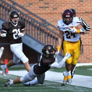 Montini’s Nick Fedanzo (24) gets knocked out of bounds. Worsom Robinson/For the Sun-Times.