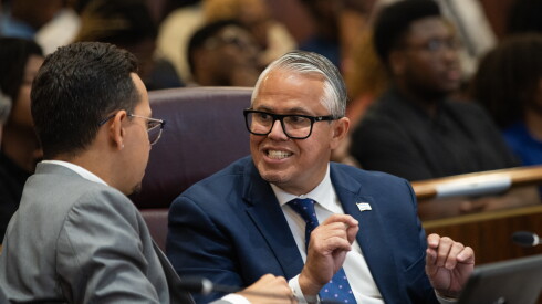 Ald. Gilbert Villegas (36th) speaks with Anthony Quezada (35th) before a City Council meeting at City Hall in the Loop, Wednesday, July 15, 2026.