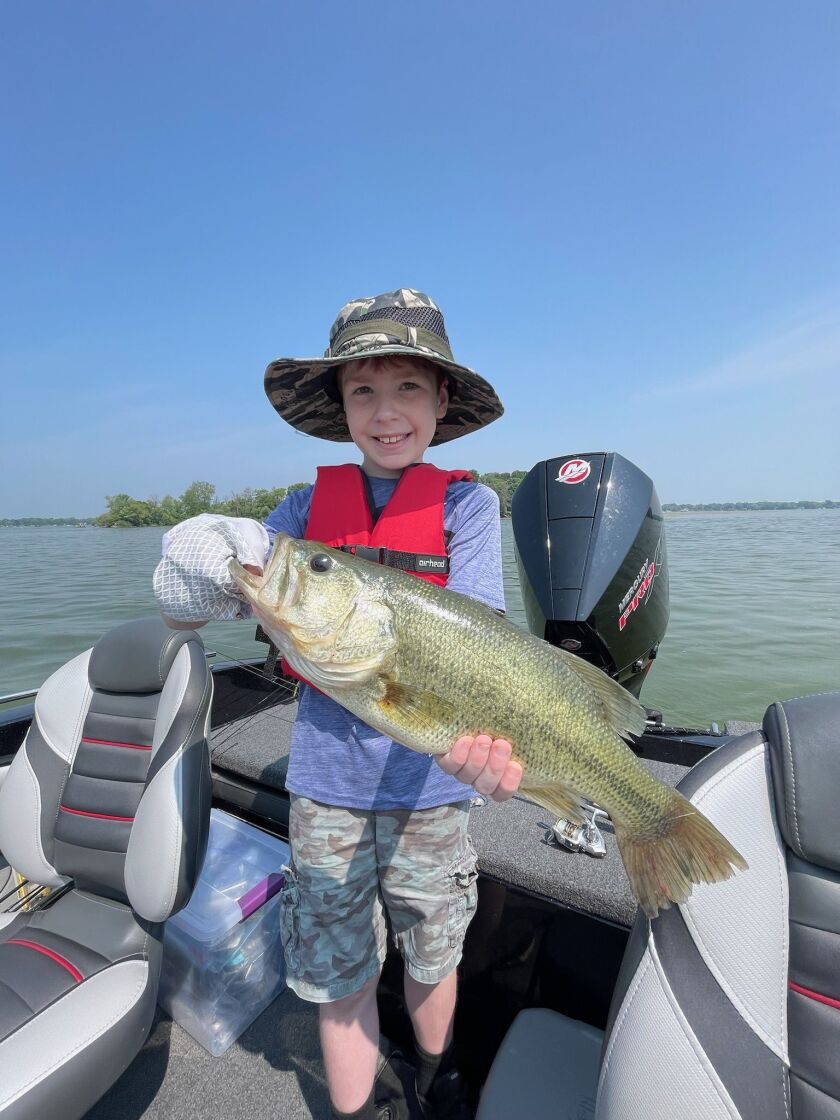 Lucas Peterson, of St Charles, with a largemouth bass he caught on Fox Lake with a Stick-O worm. Provided by Mike Norris