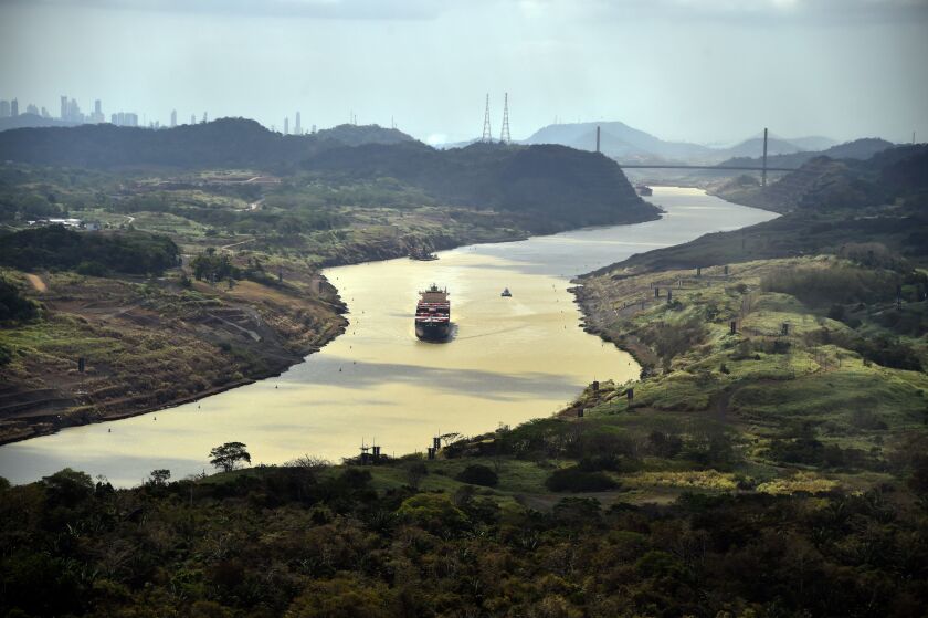 A merchant ship sails along the Panama Canal, on March 23, 2015. | RODRIGO ARANGUA/AFP/Getty Images)