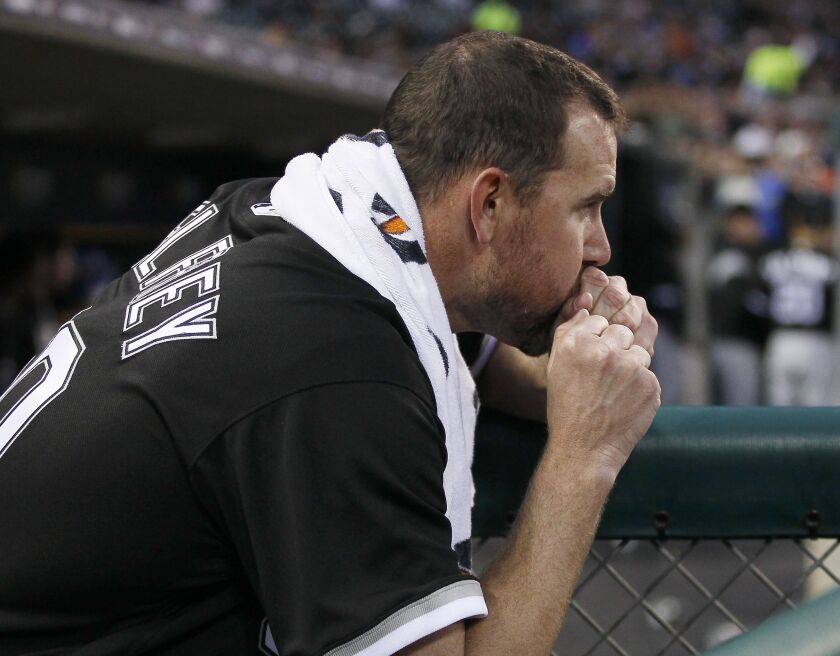 <em>Mike Pelfrey #50 of the Chicago White Sox keeps his hands warm while waiting to pitch against the Detroit Tigers during the third inning at Comerica Park on April 28, 2017 in Detroit, Michigan. (Photo by Duane Burleson/Getty Images)</em>