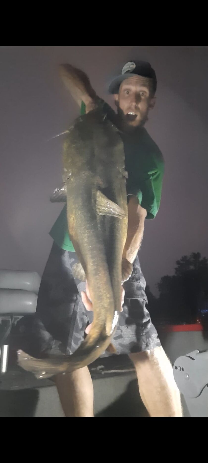 Jake Kueker shares the joy of his biggest flathead catfish, caught from the Fox River. Provided photo