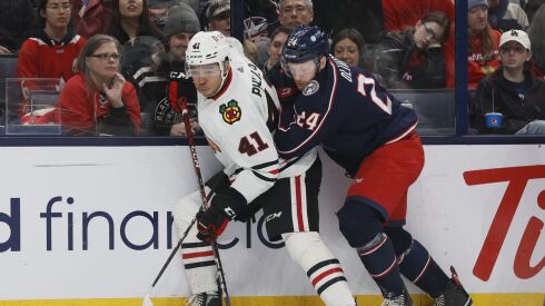 Rookie defenseman Isaak Phillips battles for the puck.