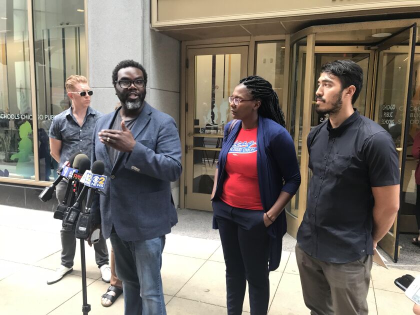 Brandon Johnson, a CTU organizer and middle school teacher, speaks at a press conference Monday. Johnson criticized the mayor’s policies for failing to adequately serve Chicago schools in need. | Yvonne Kim/Sun-Times