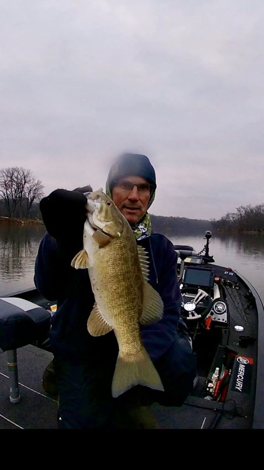 Bob Johnson with a smallmouth bass from the Kankakee River. Provided photo
