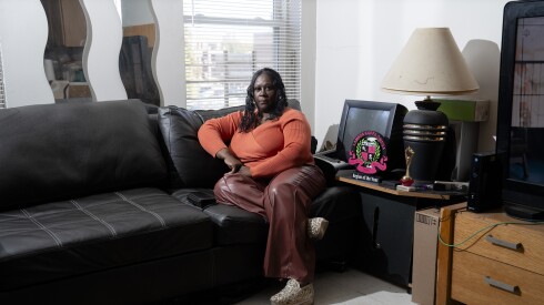 Willie Wright, a Chicago Housing Authority resident, sits in her living room in the Near West Side, Tuesday, Oct. 28, 2025. Wright has a pending work order to repair the tiles and ceiling in her living room.