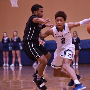 DePaul Prep’s Tyler Johnson (2) goes behind his back. Worsom Robinson/For the Sun-Times.