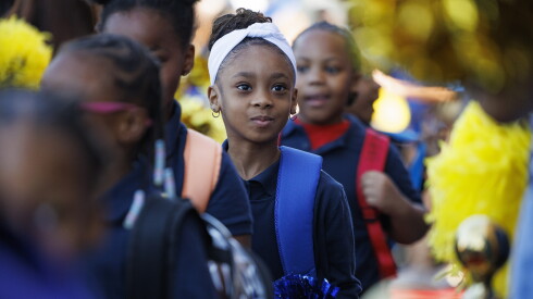 A student walks into Leland Elementary on the first day of school Monday.