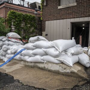 The DuPage River overflowed its banks and flooded portions of the Naperville Riverwalk Monday, May 18, 2020. A few businesses along the river started to prepare for the worst.