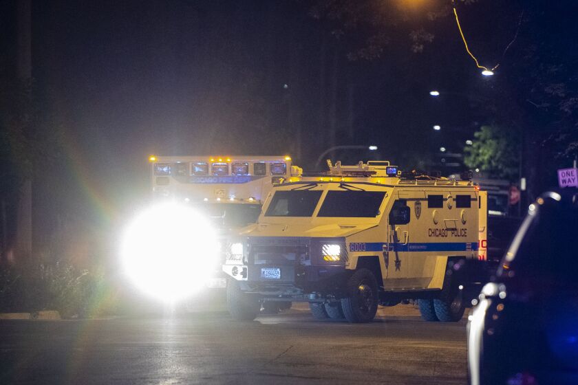 A police armored vehicle arrives at the scene of a SWAT incident Tuesday morning in the 6500 block of South Ellis. | Tyler LaRiviere/Sun-Times