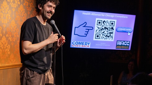 Nick Mayer performs a stand-up comedy routine at the alliance's launch event.
