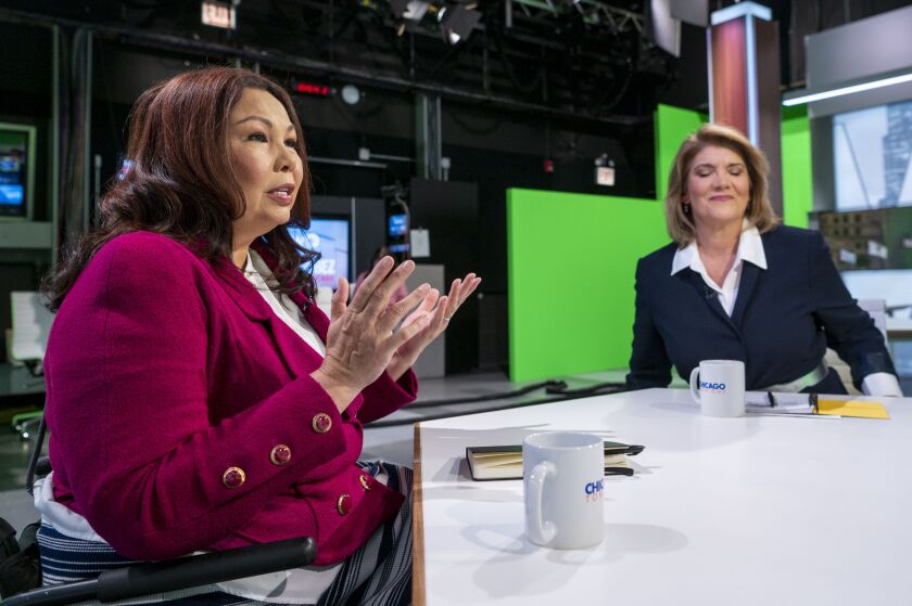 Democratic U.S. Sen. Tammy Duckworth (left) and Republican challenger Kathy Salvi prepare to participate in a forum at WTTW Studios Thursday evening.