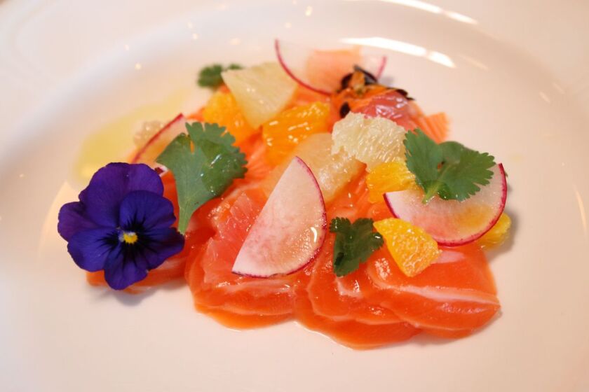 The Norwegian Trout Belly Crudo is served with citrus supremes, radish and citrus and soy vinaigrette at The Heritage restaurant. 