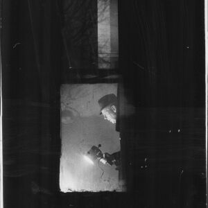 A technician from the crime laboratory searches for clues during a revisit by state’s attorney’s police to the apartment at 2337 W. Monroe where Fred Hampton and Mark Clark where slain Dec. 4, 1969.