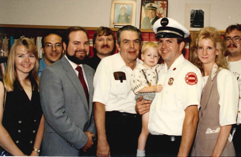 Ken Little (center) with some of his family, including son Stephen Little (just right of him), now a Chicago Fire Department battalion chief. A section of Patterson Avenue near Cicero, where he raised his family, was named in his honor. | Provided photo