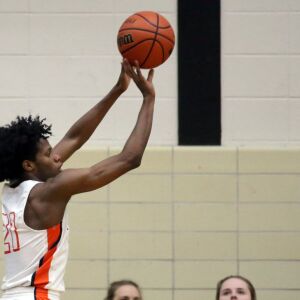 Whitney Young’s D.J. Steward (21) shoots a three pointer in their 58-56 defeat of York in Hillside, Wednesday, March 6, 2019. | Kevin Tanaka/For the Sun Times