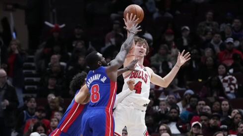 Bulls forward Matas Buzelis battles for the ball against Detroit Pistons guard Cade Cunningham, left, and forward Tim Hardaway Jr. during a game at the United Center on Feb. 12, 2025.