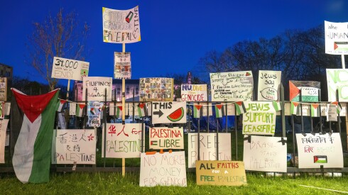 Signs protesting the war in Gaza were affixed to a fence at Northwestern University in 2024.