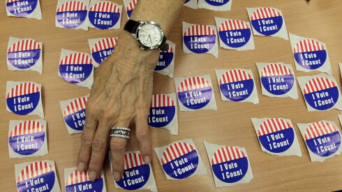 An election judge arrange 'I voted stickers at an early voting site in Marion County, Indiana in Indianapolis in 2012.
