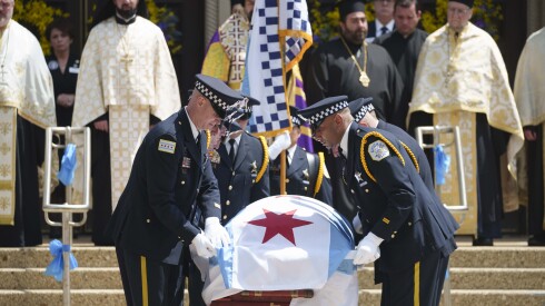 Pallbearers lift the Chicago flag that is over police Officer John Bartholomew’s casket outside St. Andrews Greek Orthodox Church in Edgewater, Friday, May 8, 2026, where the funeral for Bartholomew was held. Bartholomew was fatally shot on duty at Endeavor Health Swedish Hospital on April 25. | Pat Nabong/Sun-Times