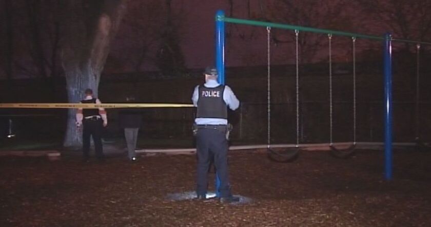Police search for evidence at a park near the scene of a fatal South Side shooting early Saturday. | Network Video Productions
