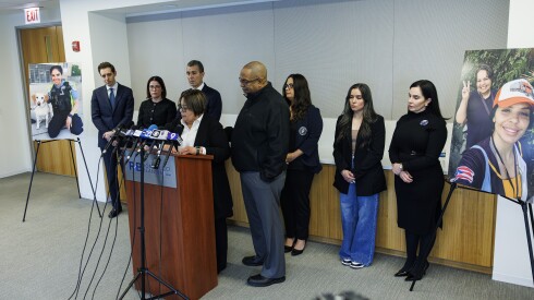 Yolanda Rivera, the mother of Chicago police Officer Krystal Rivera, at the podium of a news conference to discuss her wrongful death lawsuit in her daughter's death.