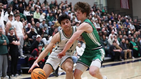 St. Patrick's Omar Ajanovic, left, drives toward the basket during the Shamrocks victory over Notre Dame.