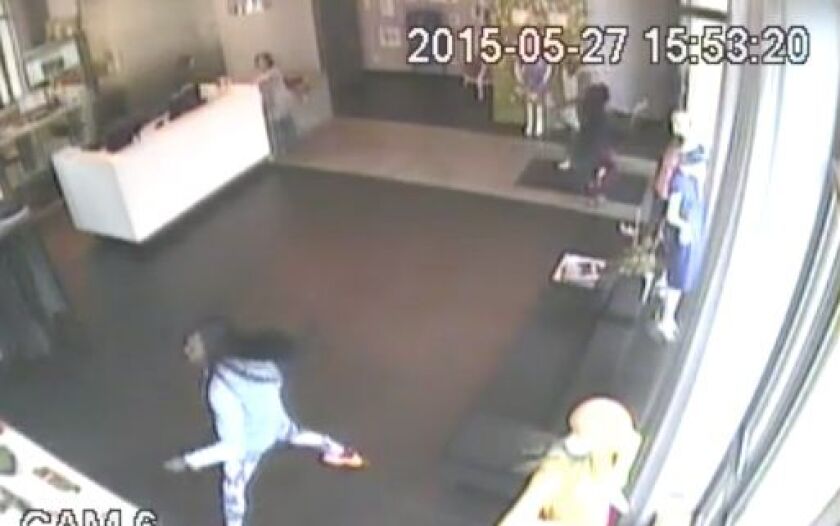 Surveillance video shows the suspects who stole four bags from luxury consignment store eDrop-Off Wednesday afternoon. | provided photo