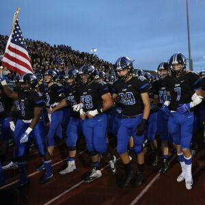 Lincoln-Way East’s captains lead the team. Allen Cunningham/For the Sun-Times.