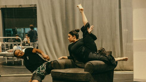 Melvin Diggs (left) and Nancy Luna rehearsing a scene for “The Attic: Things I’ve Seen While Lying on My Back." Shana Carroll's physical memoir is brought to life through nine acrobats’ extraordinary feats of grace, physical strength and dexterity.
