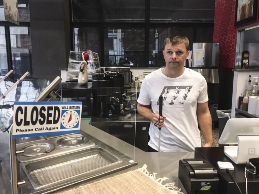 Janusz Leja, 37, closed his coffee-and-sandwich bar at the Metcalfe Federal Building downtown<br>after the partial government shutdown began. | Stefano Esposito/Sun-Times