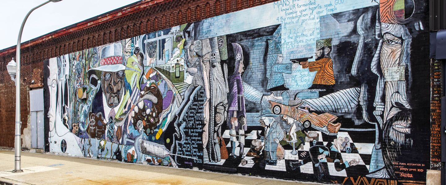 “Wall of Daydreaming, Man’s Inhumanity to Man” at 47th Street and Calumet Avenue was painted by Mitchell Caton and Bill Walker.
