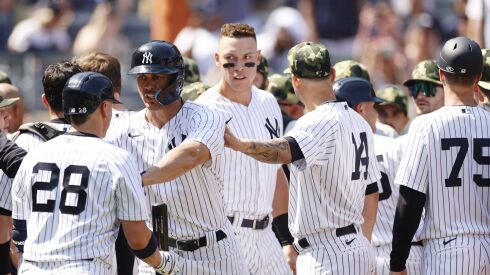 Josh Donaldson is held back during bench clearing incident in New York on Saturday.