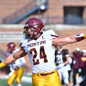 Montini’s Nick Fedanzo (24) runs in for a touchdown. Worsom Robinson/For the Sun-Times.