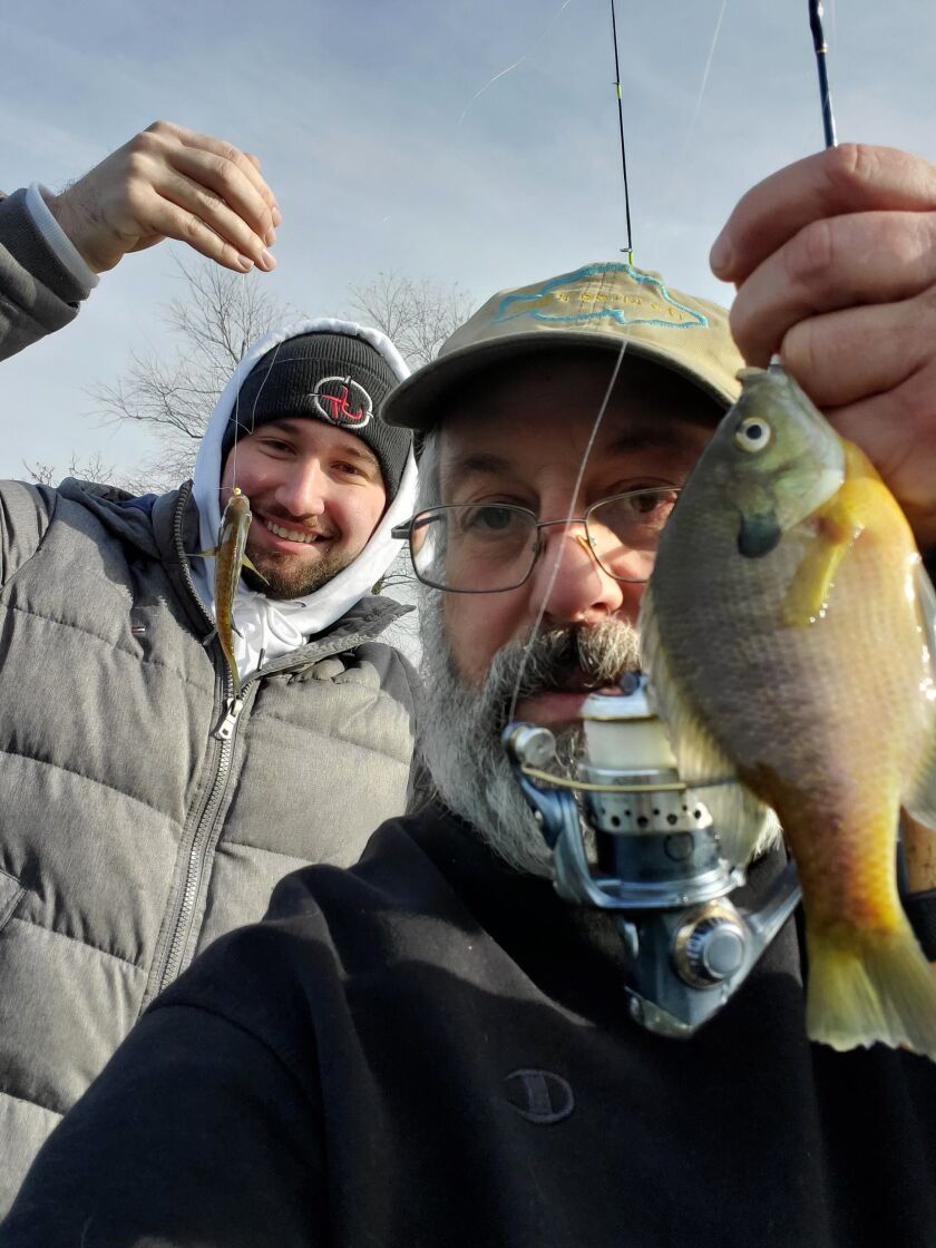 David Bukowski (back) and Bob France ice fishing with success in Roselle on Sunday. Provided photo