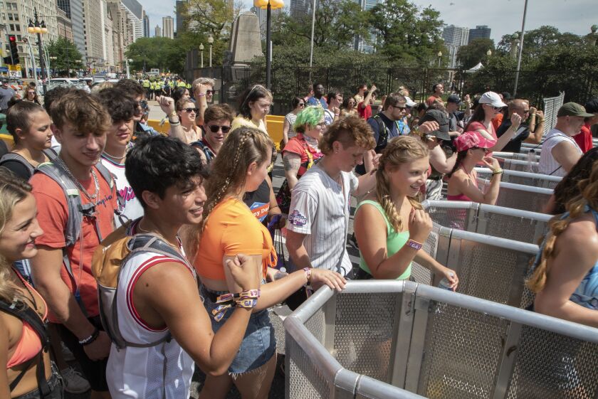 The crowd enters Lollapalooza as it opens at 11:00 at Michigan Ave. and Van Buren St. Thursday, July 28, 2022.
