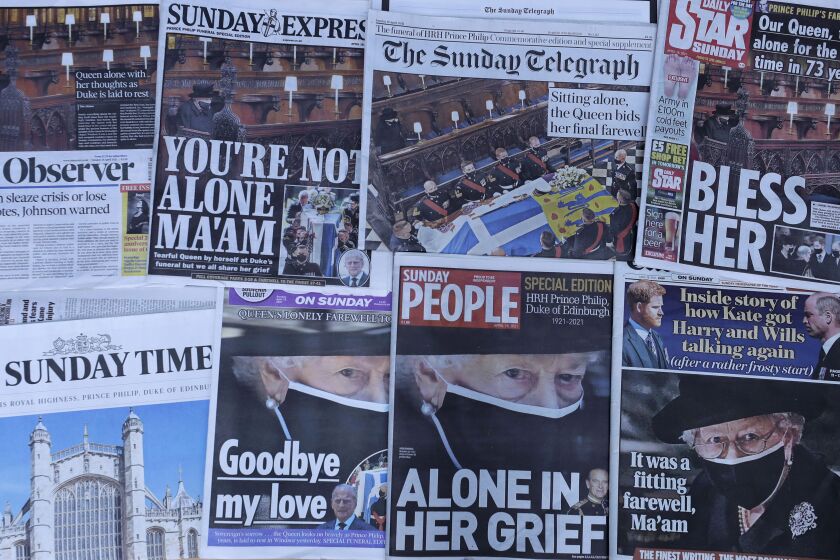 British newspapers showing coverage of the funeral of Britain’s Prince Philip are displayed in London, on Sunday.